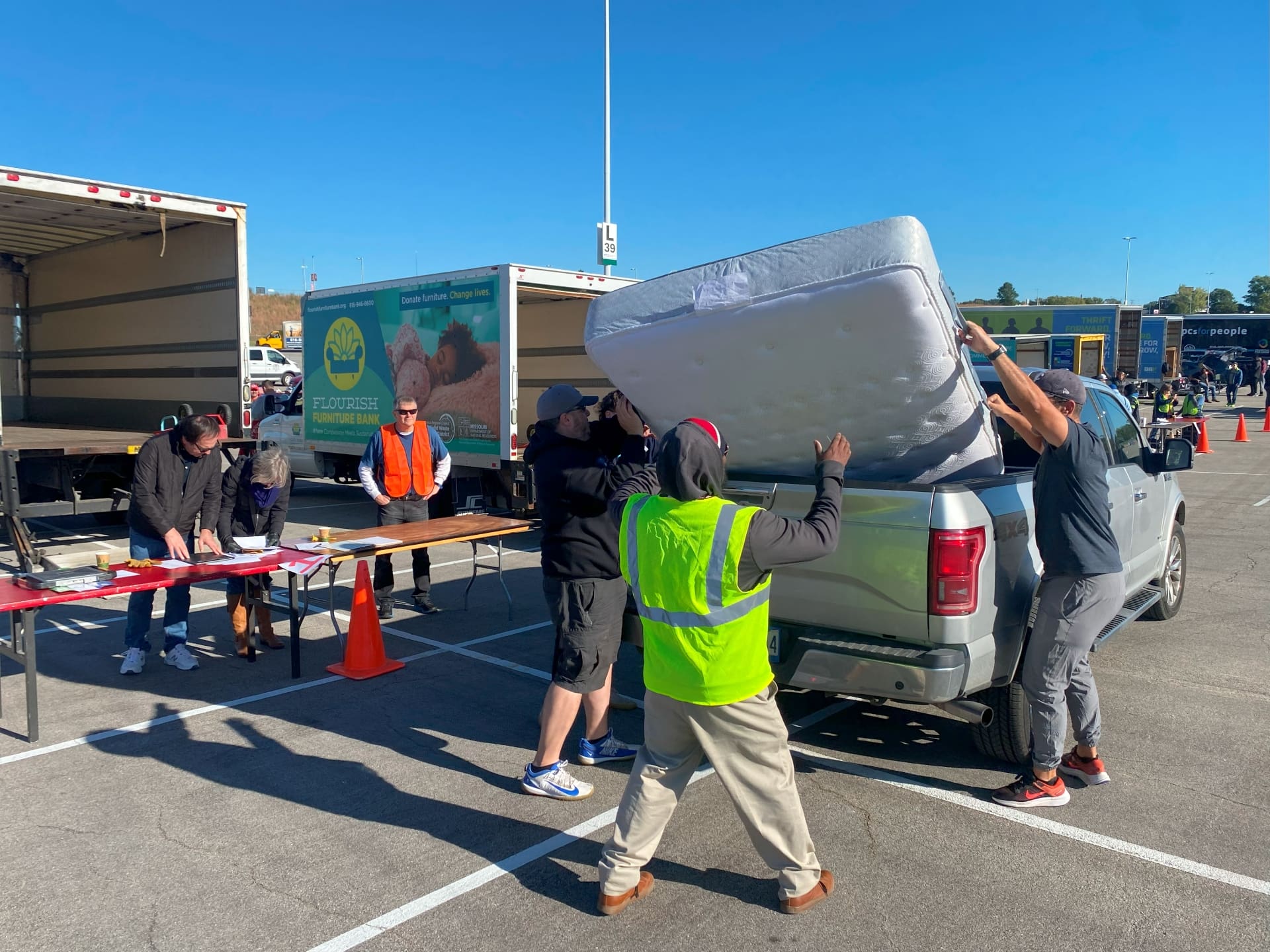 Volunteers unloading donations at Un-Dumpster Day