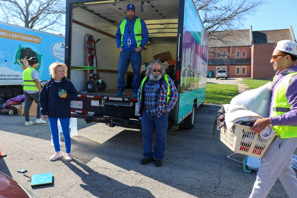 Volunteers unloading donations at Un-Dumpster Day